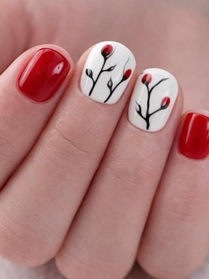 Red gel manicure with hand-painted floral art